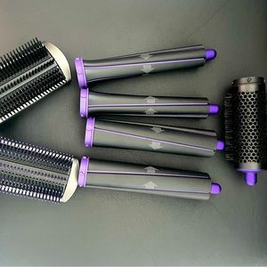 Brand new never used Dyson attachments kit. Purple addition